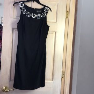 Sleek Black dress with gemstone neckline